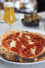 Meat lovers sampler of pizzas - sausage, pepperoni, spicy soprressata.