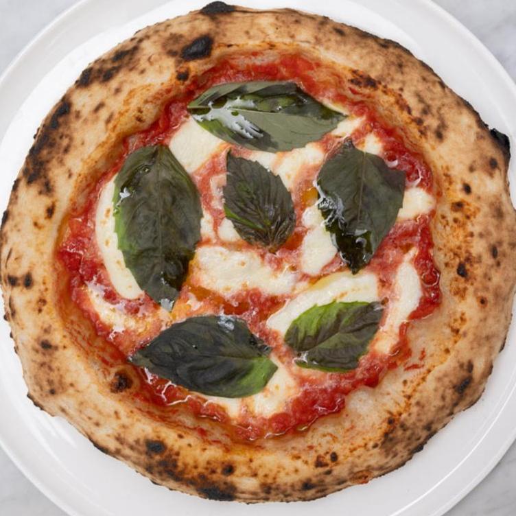 Margherita pizza with basil leaves